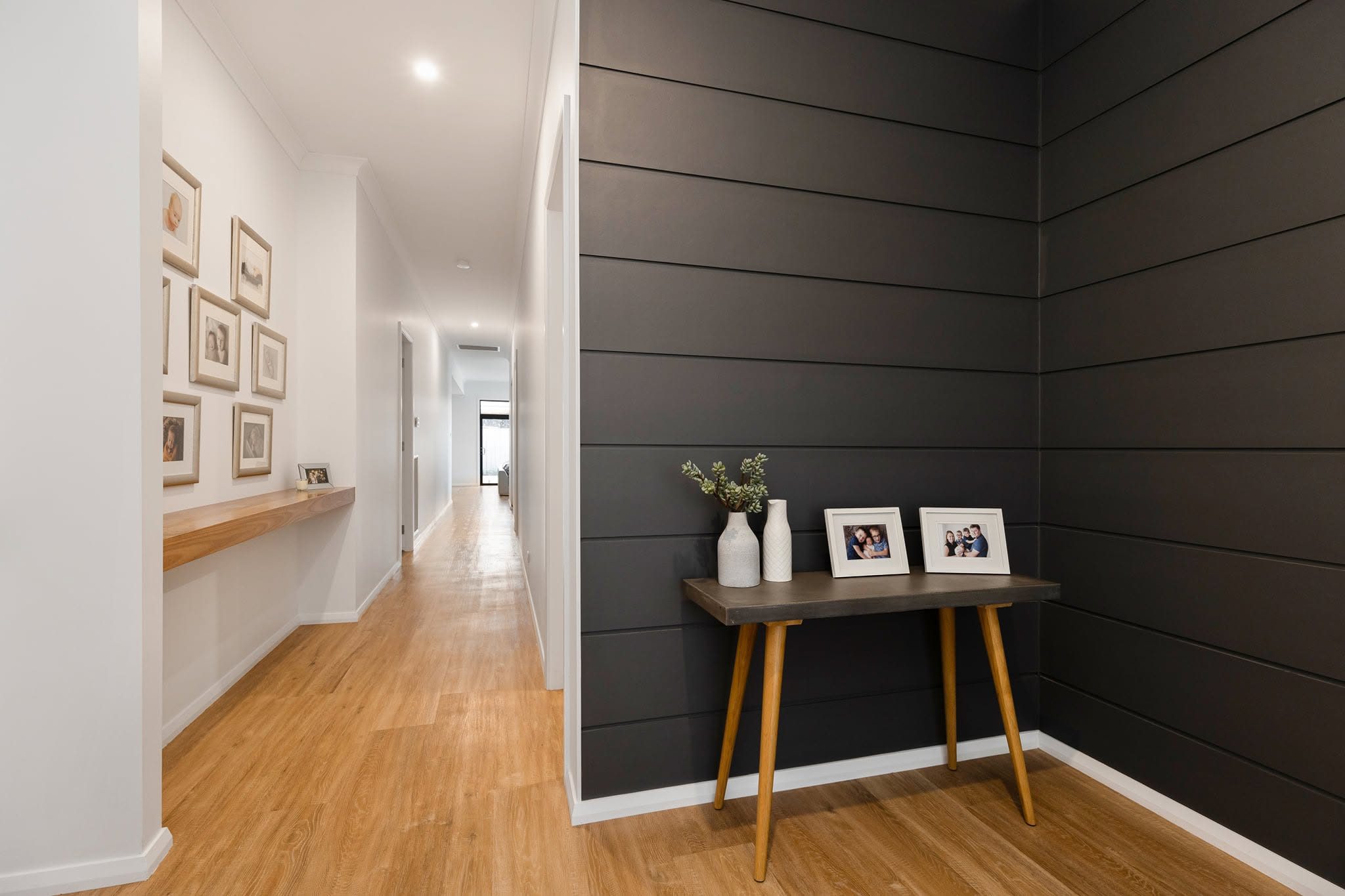 Hallway with charcoal shiplap feature wall and solid timber console