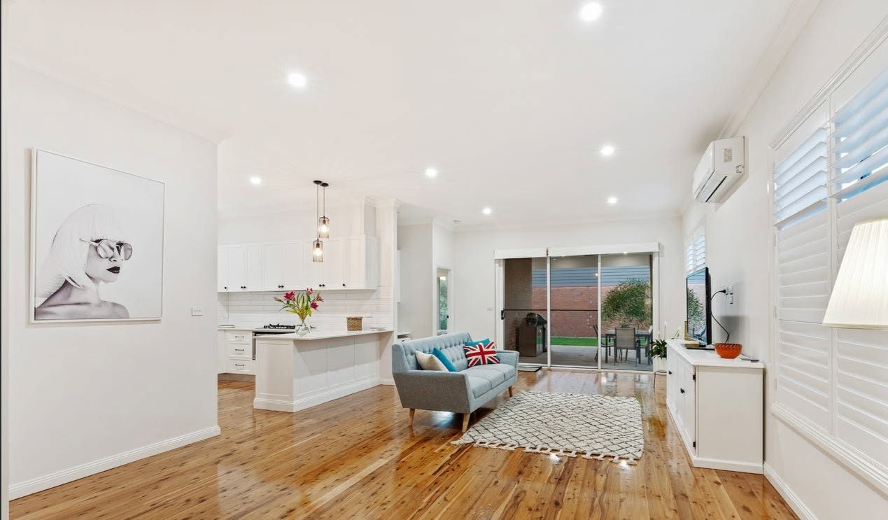 Renovated open-plan living area with timber floors
